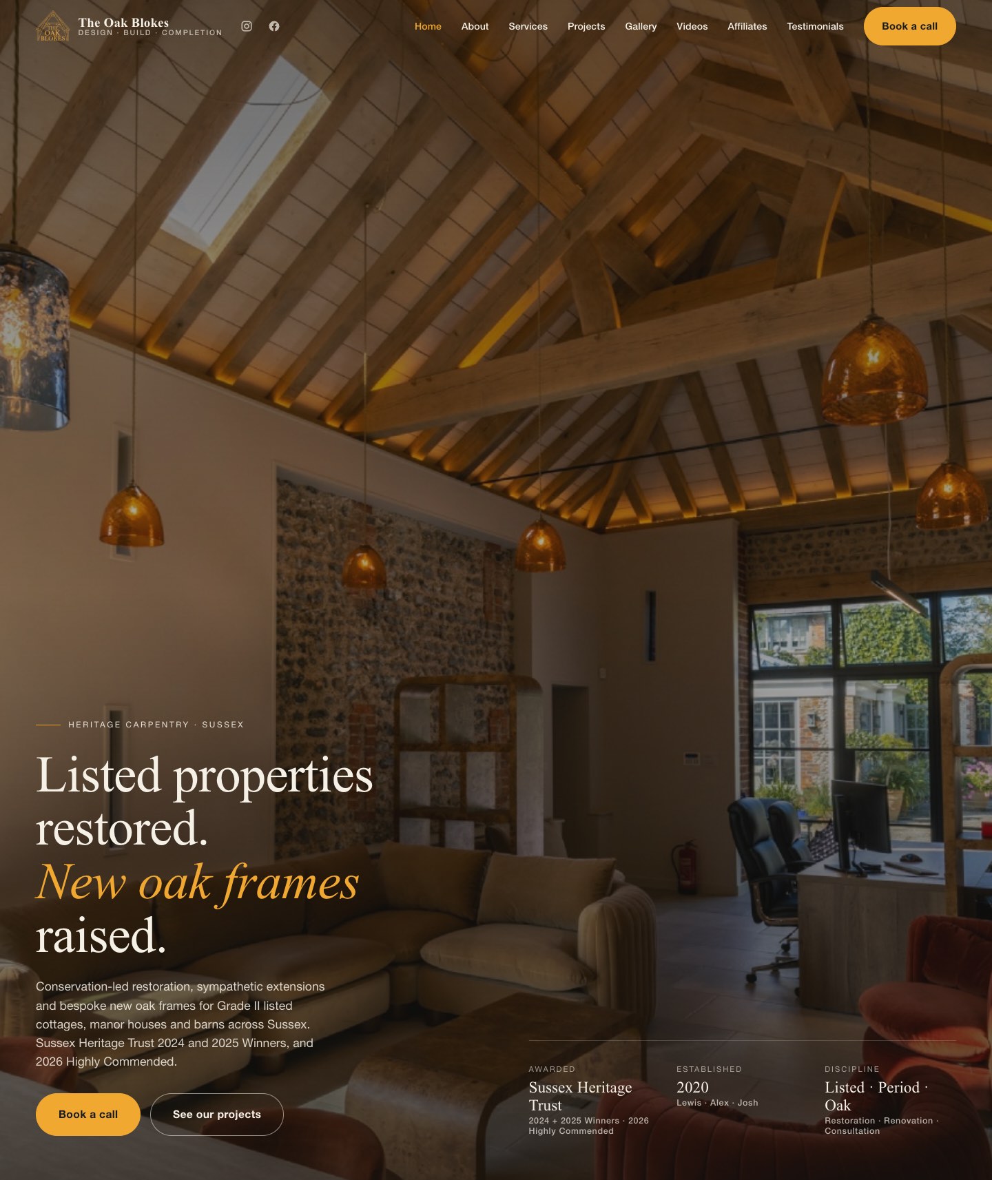 The Oak Blokes homepage — heritage carpentry site with a warm oak-framed barn interior